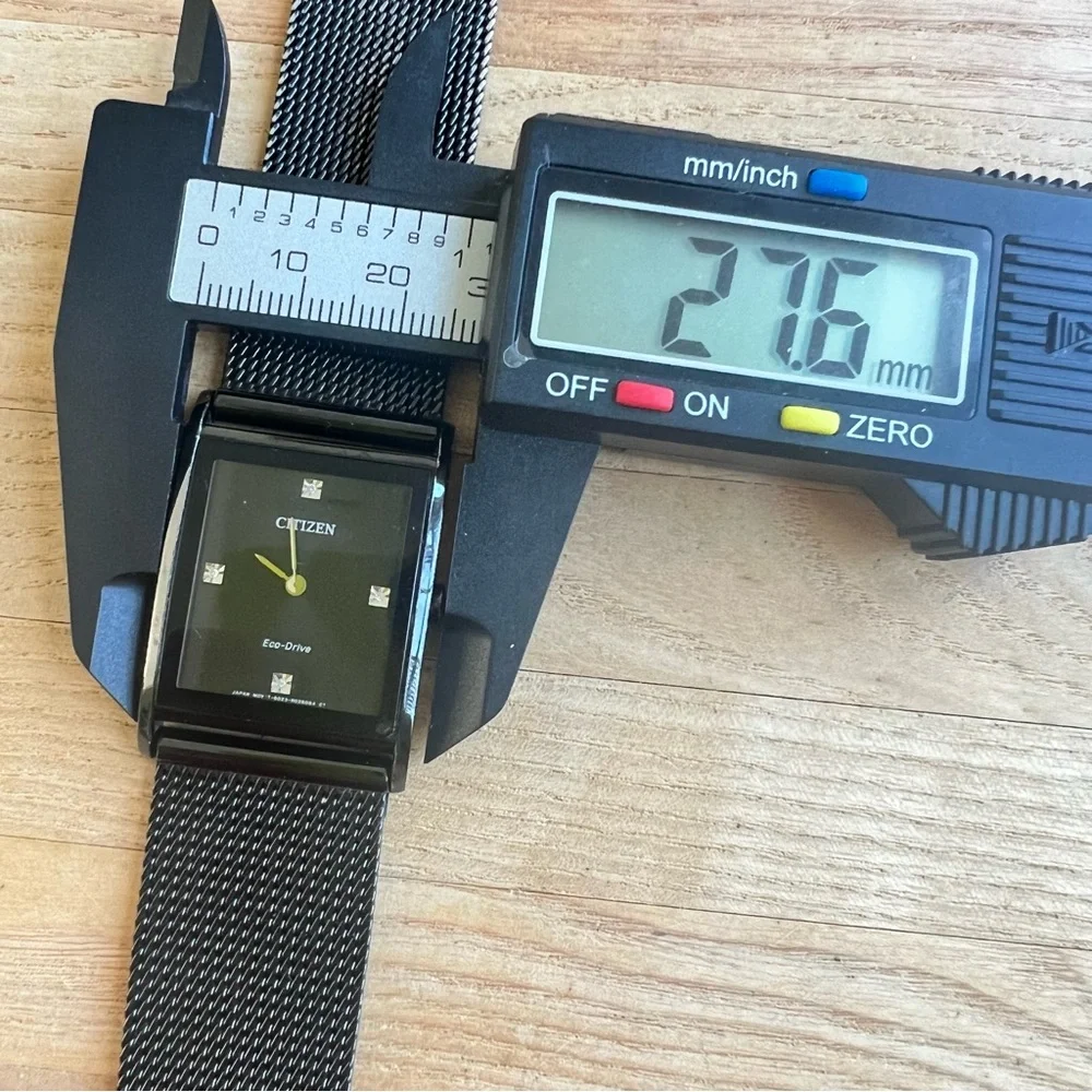 Citizen Eco-drive mens axiom black dial rectangular dress watch